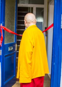 Picture of Choje Lama Yeshe Rinpoche cutting the ribbon of the new Tibetan Centre